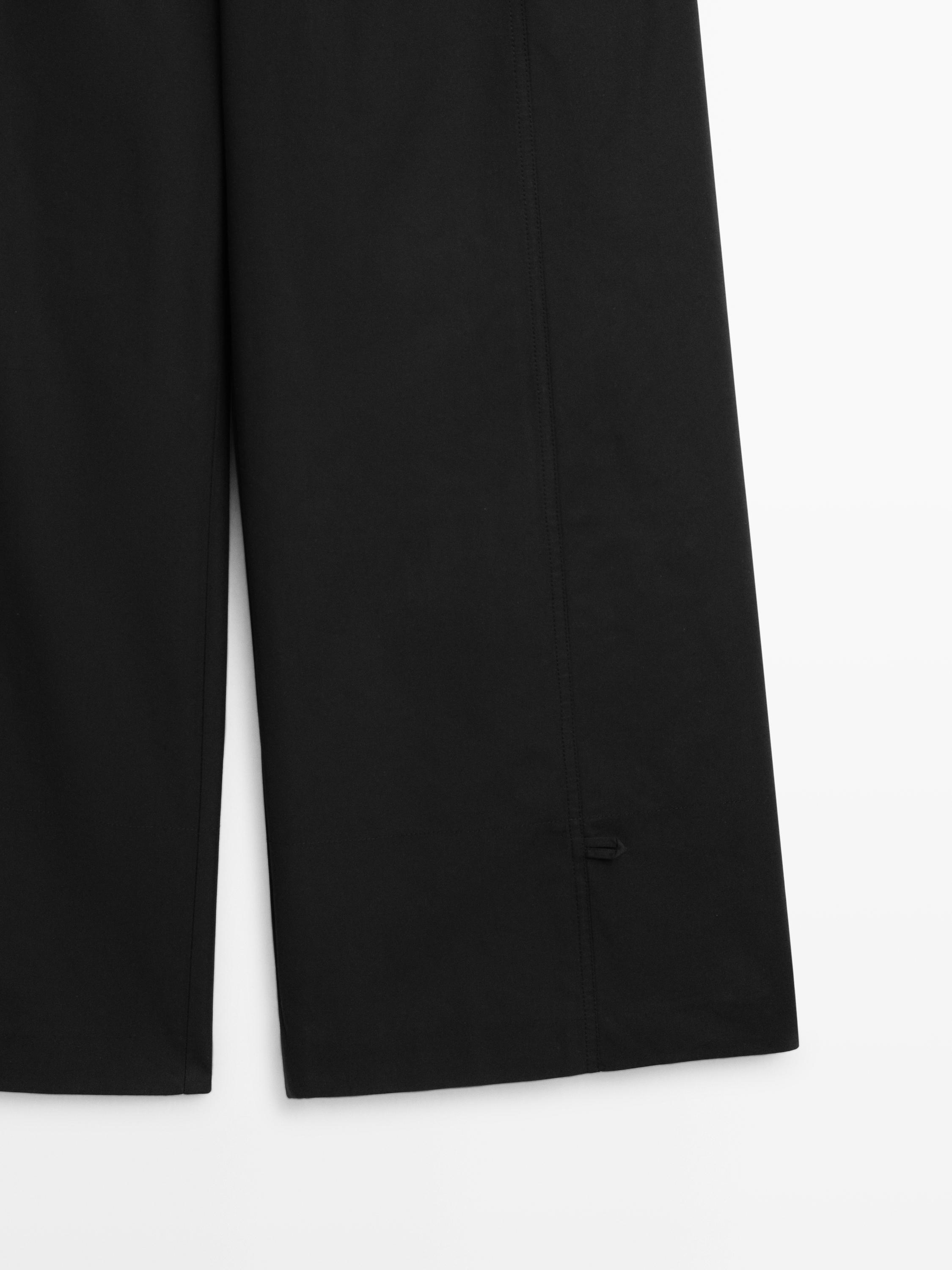 Cotton blend trousers with hem detail